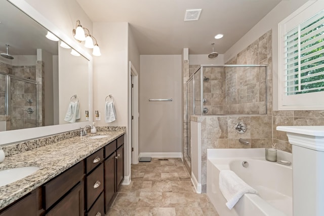 6006 Trotwood Ln, Spring Hill, TN 37174 - full bath with visible vents, a garden tub, double vanity, a shower stall, and a sink