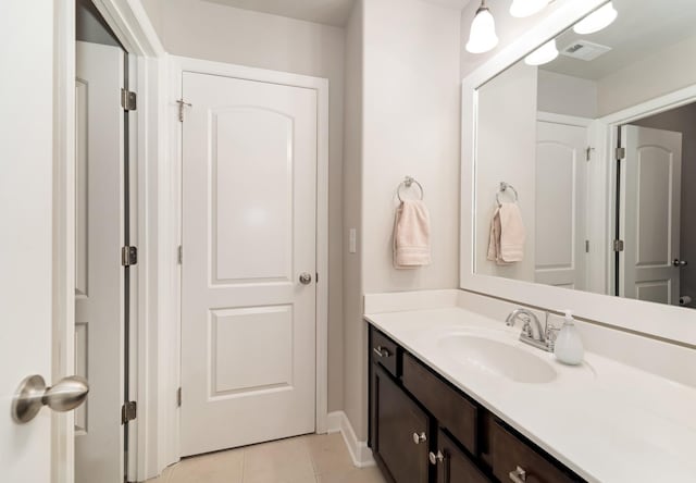 6006 Trotwood Ln, Spring Hill, TN 37174 - bathroom with tile patterned floors, baseboards, and vanity