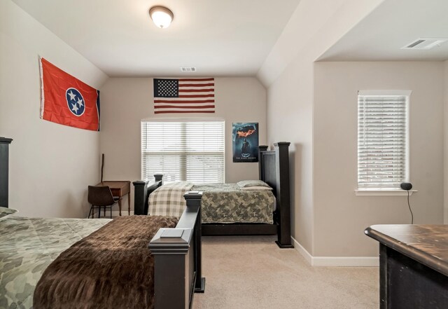 6006 Trotwood Ln, Spring Hill, TN 37174 - bedroom with visible vents, baseboards, lofted ceiling, and light colored carpet