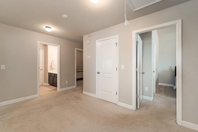 6006 Trotwood Ln, Spring Hill, TN 37174 - unfurnished bedroom with baseboards, attic access, and light colored carpet