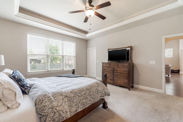 6006 Trotwood Ln, Spring Hill, TN 37174 - bedroom featuring ceiling fan, arched walkways, a raised ceiling, baseboards, and carpet flooring