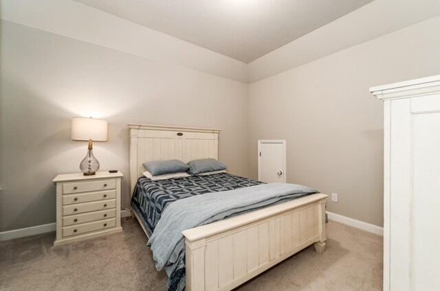 6006 Trotwood Ln, Spring Hill, TN 37174 - bedroom with baseboards, light carpet, and lofted ceiling