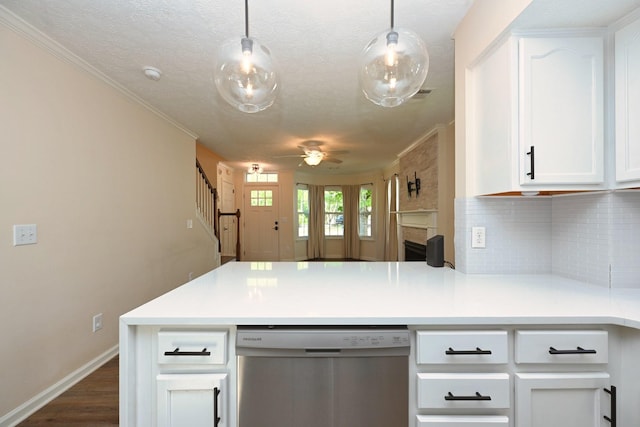 kitchen featuring decorative backsplash, ceiling fan, dishwasher, white cabinets, and a peninsula
