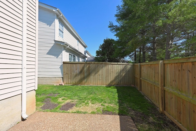 view of yard with a fenced backyard