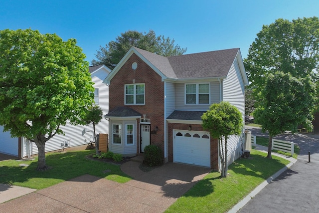 traditional-style house with brick siding, driveway, a shingled roof, and a front yard
