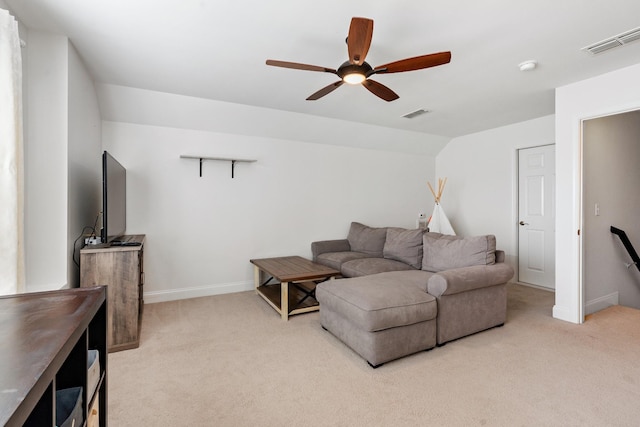 living area with ceiling fan, visible vents, and carpet