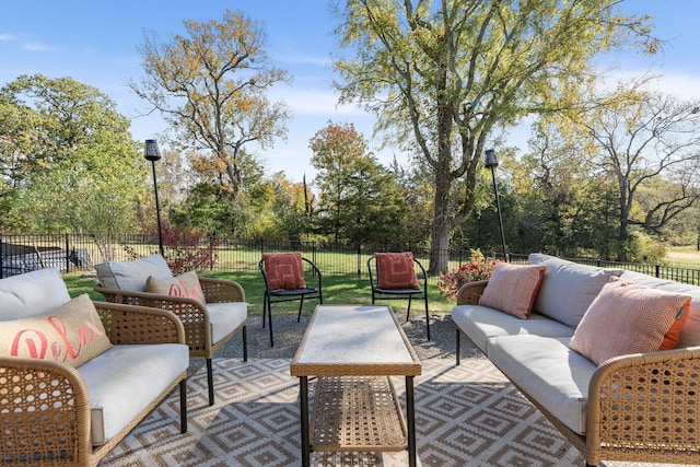 view of patio / terrace featuring a fenced backyard and an outdoor living space