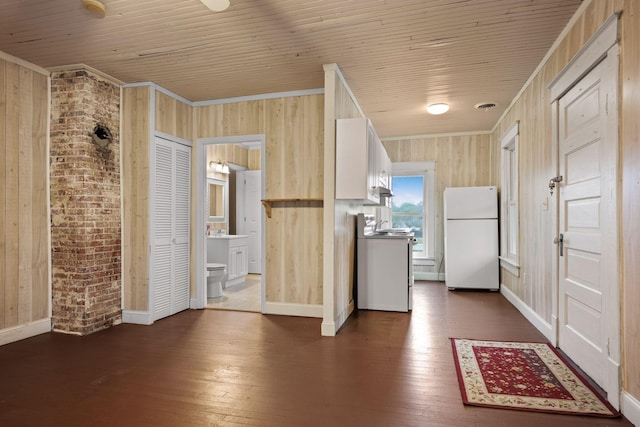 kitchen featuring dark wood-style flooring, stove, freestanding refrigerator, baseboards, and wood ceiling