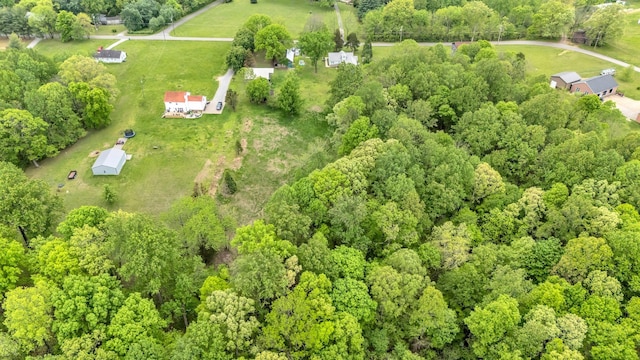 bird's eye view with a rural view and a wooded view