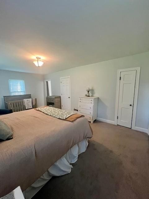 carpeted bedroom featuring baseboards