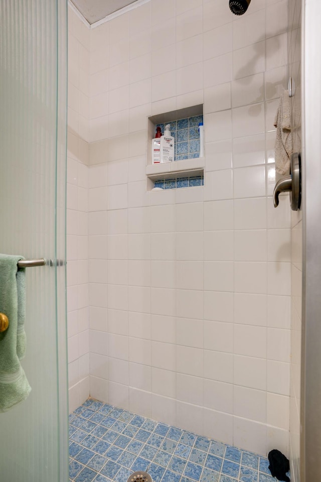 bathroom with tiled shower