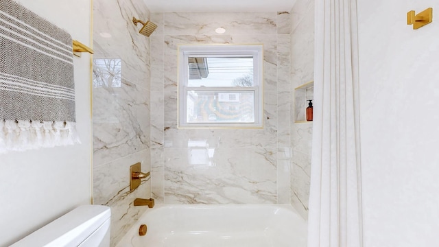bathroom with toilet and washtub / shower combination