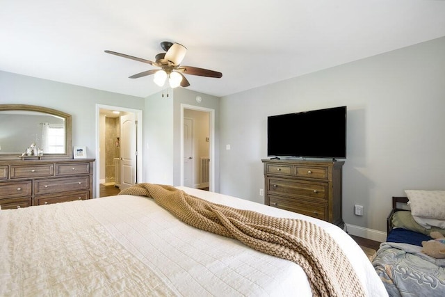 1121 Walnut Grove Church Rd, Dayton, TN 37321 - bedroom featuring connected bathroom, baseboards, ceiling fan, and wood finished floors