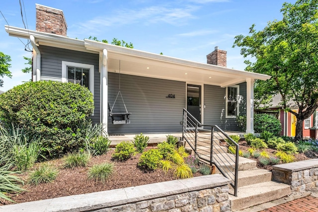 view of front of house with a chimney