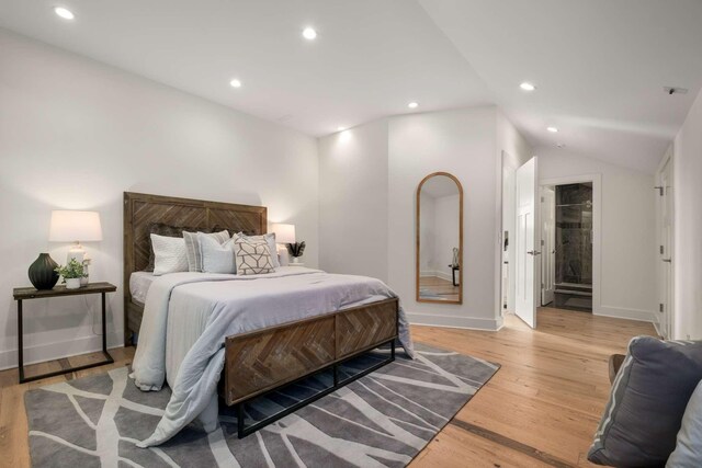 bedroom with recessed lighting, baseboards, lofted ceiling, and light wood finished floors