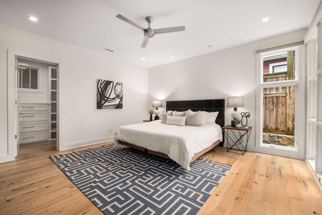 bedroom featuring recessed lighting, a ceiling fan, baseboards, and hardwood / wood-style flooring