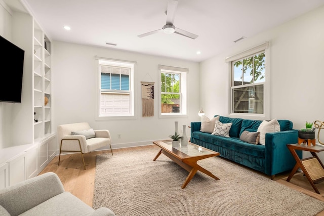 living area featuring recessed lighting, ceiling fan, wood finished floors, and visible vents