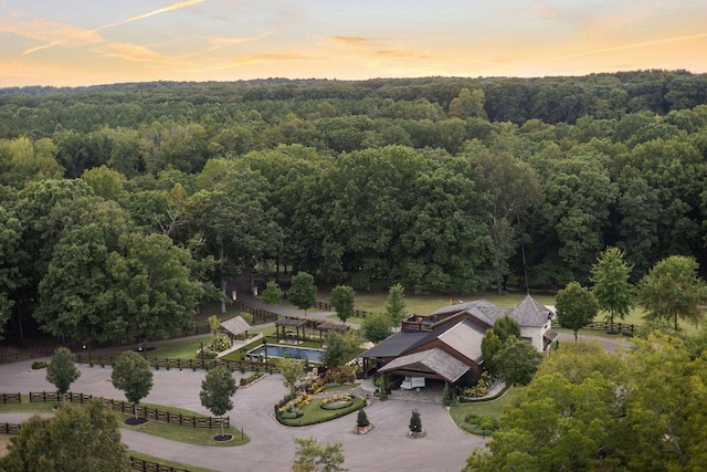 5715 Greenbrier Rd, Franklin, TN 37064 - aerial view at dusk featuring a wooded view