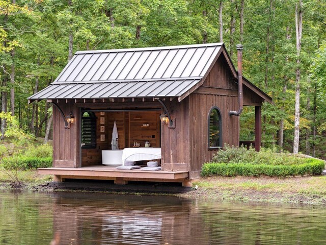 5715 Greenbrier Rd, Franklin, TN 37064 - view of outbuilding with an outdoor structure, a water view, and a forest view