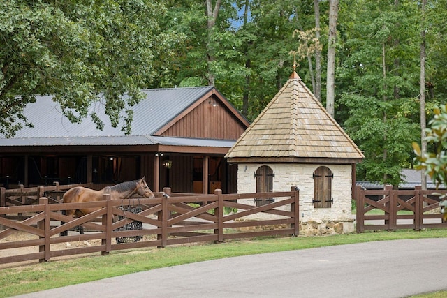 5715 Greenbrier Rd, Franklin, TN 37064 - view of front of property featuring an outbuilding, an exterior structure, metal roof, and stone siding