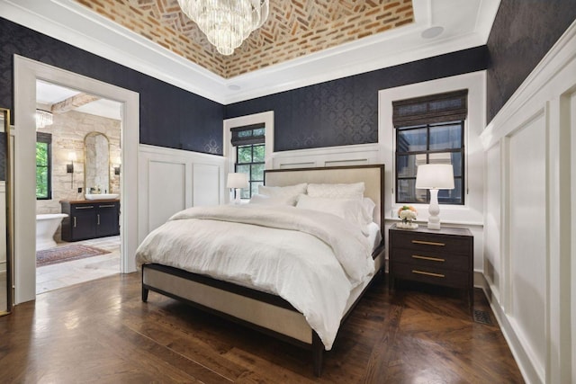 5715 Greenbrier Rd, Franklin, TN 37064 - bedroom with a notable chandelier, ensuite bath, a decorative wall, brick ceiling, and ornamental molding