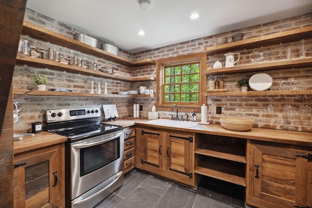 5715 Greenbrier Rd, Franklin, TN 37064 - kitchen with a sink, open shelves, brown cabinets, and electric stove
