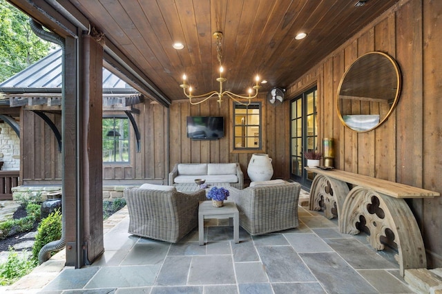 5715 Greenbrier Rd, Franklin, TN 37064 - sitting room featuring recessed lighting, wooden ceiling, wood walls, and stone tile floors
