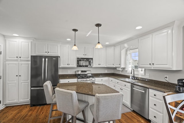kitchen with recessed lighting, appliances with stainless steel finishes, and a sink