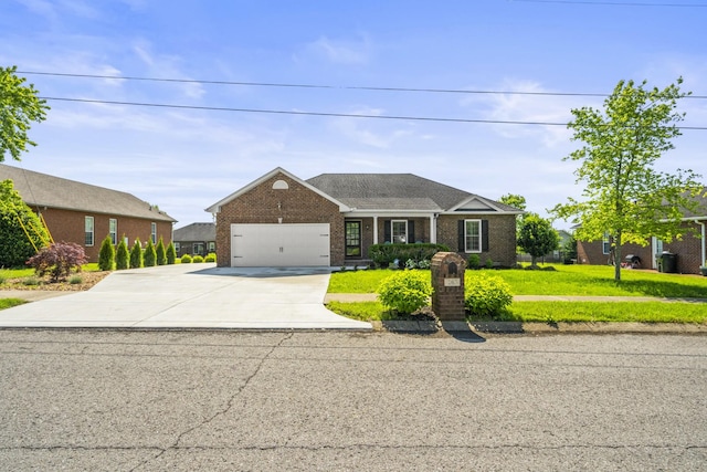 traditional-style house with brick siding, a front lawn, an attached garage, and concrete driveway