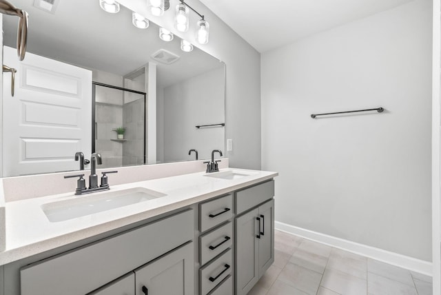 175 Harvard Dr, Gallatin, TN 37066 - bathroom with a sink, baseboards, a stall shower, and visible vents