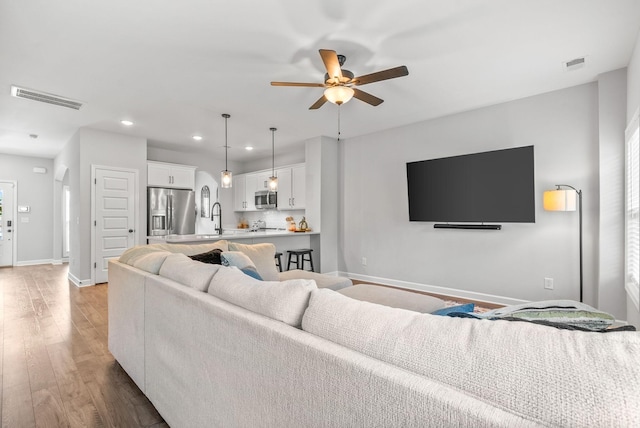 175 Harvard Dr, Gallatin, TN 37066 - living room featuring recessed lighting, a ceiling fan, light wood-type flooring, and visible vents