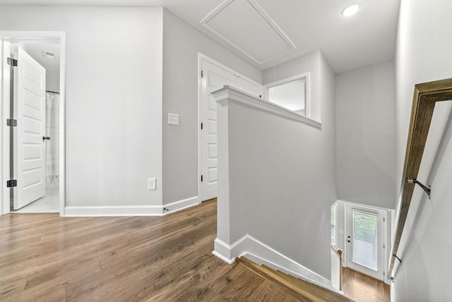 175 Harvard Dr, Gallatin, TN 37066 - hallway featuring attic access, visible vents, wood finished floors, baseboards, and an upstairs landing