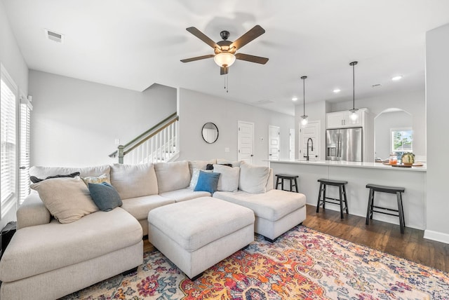 175 Harvard Dr, Gallatin, TN 37066 - living room with visible vents, ceiling fan, recessed lighting, dark wood-type flooring, and arched walkways