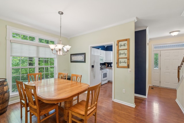 1005 Lauren Cir, Burns, TN 37029 - dining room featuring baseboards, ornamental molding, wood finished floors, and a chandelier