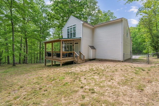 1005 Lauren Cir, Burns, TN 37029 - rear view of property with fence, a gate, a yard, and a deck