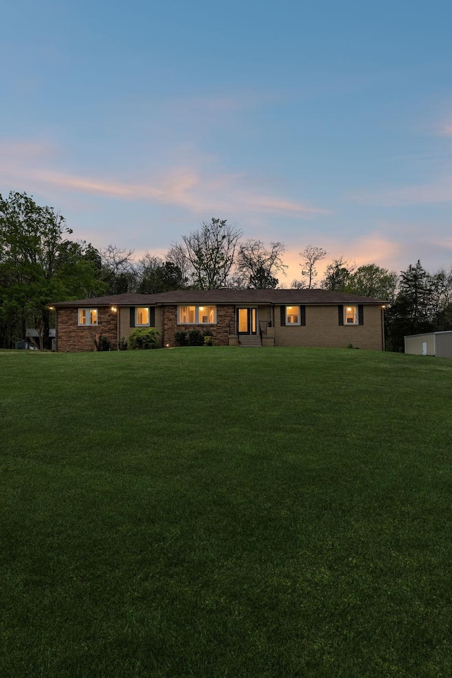 921 Cooks Rd, Mount Juliet, TN 37122 - view of front of house with a lawn and brick siding