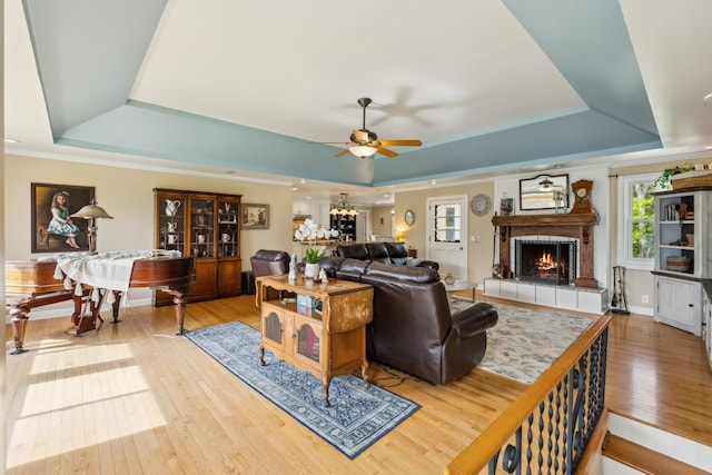921 Cooks Rd, Mount Juliet, TN 37122 - living area featuring a tray ceiling, ceiling fan, hardwood / wood-style flooring, and a fireplace
