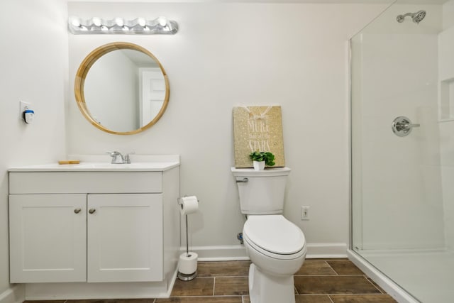 921 Cooks Rd, Mount Juliet, TN 37122 - bathroom with vanity, baseboards, toilet, and a shower stall