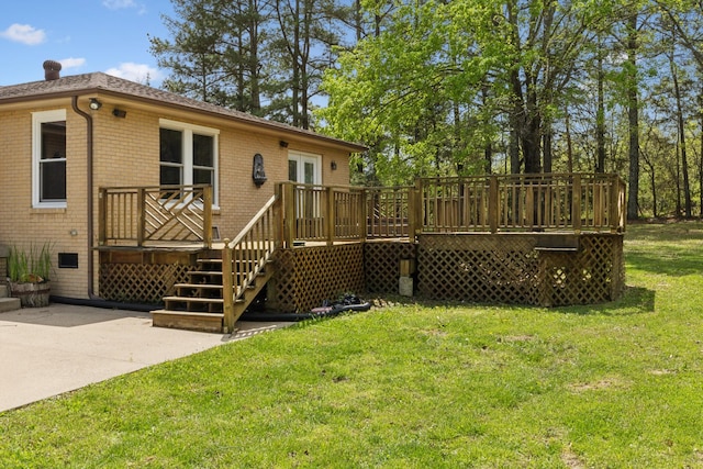 921 Cooks Rd, Mount Juliet, TN 37122 - rear view of house with a wooden deck, brick siding, a patio area, a lawn, and stairway