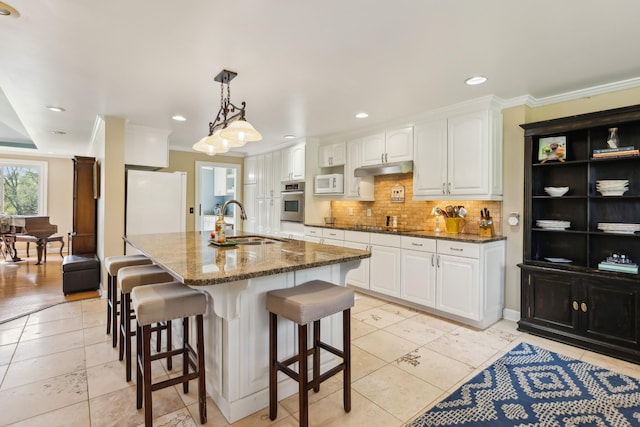 921 Cooks Rd, Mount Juliet, TN 37122 - kitchen featuring white appliances, light tile patterned floors, decorative backsplash, and a sink