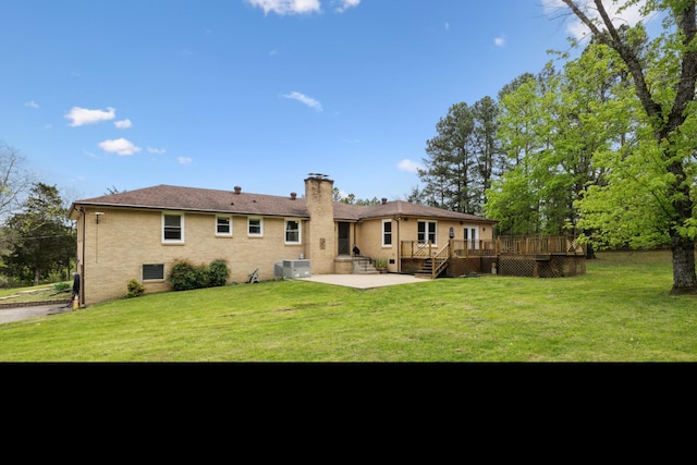 921 Cooks Rd, Mount Juliet, TN 37122 - back of property with a lawn, a chimney, a patio area, and a wooden deck