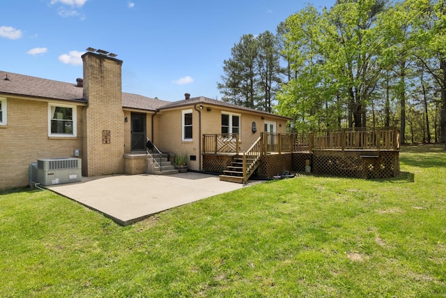 921 Cooks Rd, Mount Juliet, TN 37122 - rear view of property featuring central AC, a chimney, brick siding, a patio area, and a yard