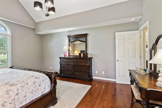 bedroom with baseboards, a notable chandelier, dark wood-style floors, and lofted ceiling