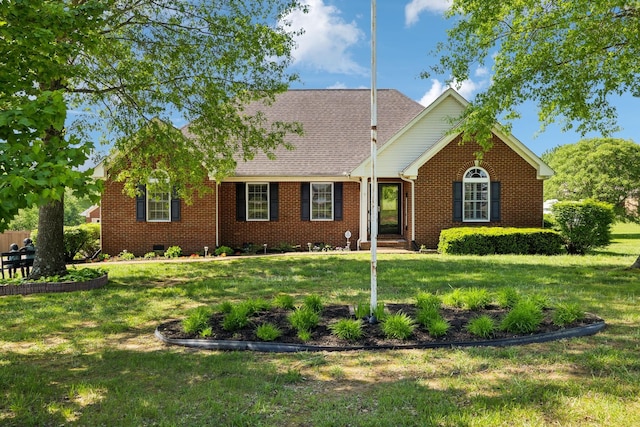ranch-style home with brick siding and a front lawn