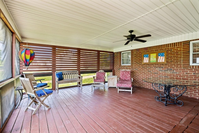 sunroom / solarium with ceiling fan