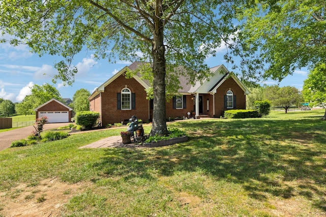 single story home with a garage, a front lawn, and brick siding