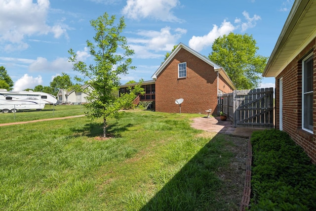 view of yard with fence and a gate