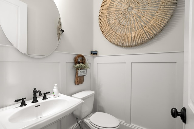 bathroom with a sink and toilet