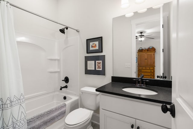 bathroom with vanity, a ceiling fan, shower / bathtub combination with curtain, and toilet