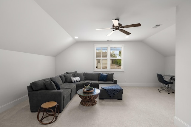 living area featuring visible vents, carpet, baseboards, and vaulted ceiling